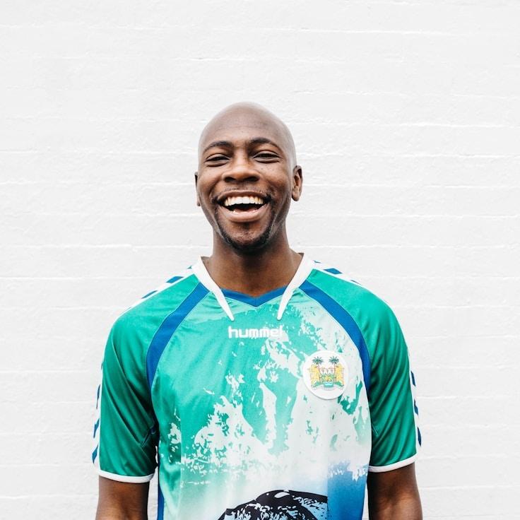 Samantha Reed, Lead Design Curator at CloudMintTrail, reviewing corporate floral arrangements